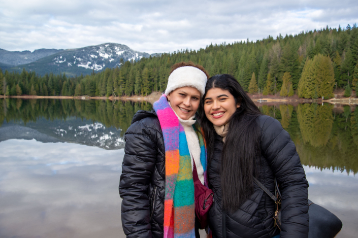 Mom-Portrait-landscape Family portrait smiling together outdoors.